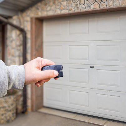 Cleveland security key fob pointing to a garage door